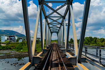 Railway bridge over the river. The old railway in the city of Nha Trang in Vietnam.