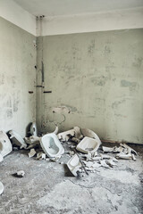 Room with broken sinks in the corner. Abandoned soviet spa resort (sanatorium) Shakhter (Miner), in Tskaltubo, Georgia.  - obrazy, fototapety, plakaty