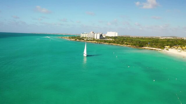 Aerial Drone View of Eagle Beach, Aruba &ndash; Turquoise Waters, Sailboat, and Iconic Fofoti Tree