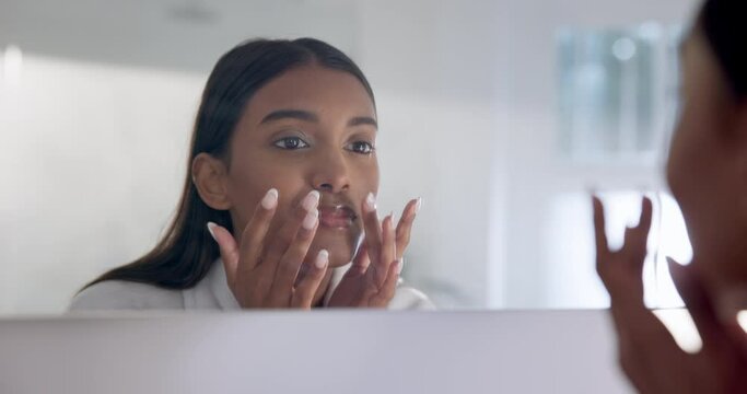 Skincare, bathroom and woman with hands on face for beauty routine, cream and glow in home. Getting ready, girl in mirror for morning skin treatment, cleaning and fresh facial in reflection in house.