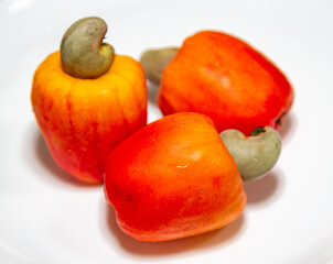 Fresh ripe cashew fruits isolated on white background. Cashew nut. (Anacardium occidentale)