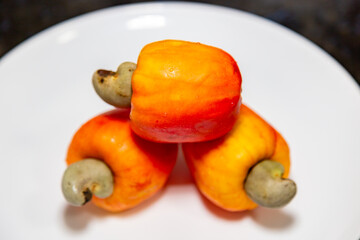 Fresh ripe cashew fruits isolated on white background. Cashew nut. (Anacardium occidentale)