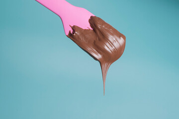 chocolate dripping from a spoon