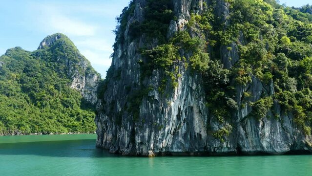 Sailing past some of the many tropical islands of Halong Bay Vietnam.
