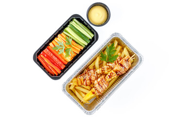 chicken skewers with pineapple, French fries, bell pepper, carrots, cucumber, cheese sauce
 on a white background, studio shot