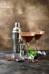 Delicious chocolate coffee martini with mint in a glasses .
