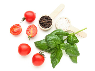 Fresh basil, cherry tomatoes and peppercorn on white background