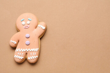 Tasty gingerbread man on color background