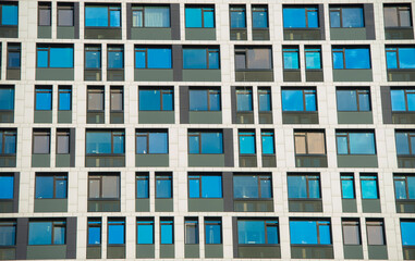 Fototapeta na wymiar fragment of the facade of a modern building with windows