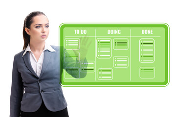 Businesswoman working on kanban board with tasks