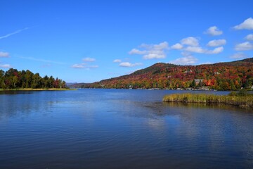 view across lake Tremblant towards the Laurentian mountains in beautiful Autumn colours