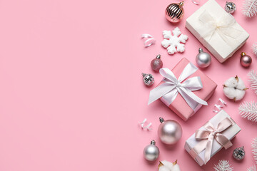 Composition with gifts and Christmas decor on pink background