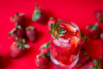  closeup detail of a strawberry drink with a red background