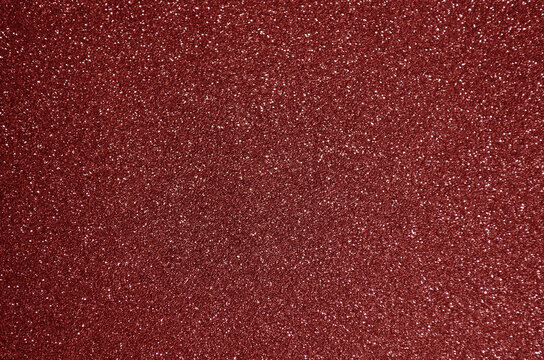 Fototapeta Fondo de brillos / textura glitter de color rojo. Se puede usar como fondo de año nuevo