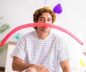 Young man celebrating his birthday in hospital