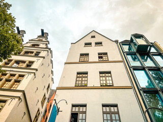 Looking up at contrasting traditional and modern architecture in Cologne, Germany. Located in the...