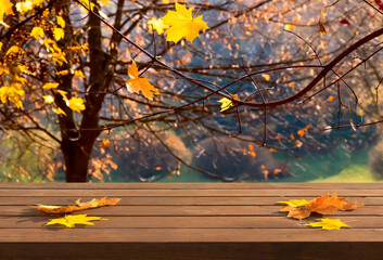 Naklejka na ściany i meble Empty of wood table with autumn maple leaves