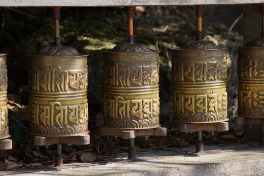 buddhist tibetan prayer wheels in the sunlight