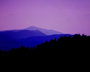 purple sunset in the mountains and forest