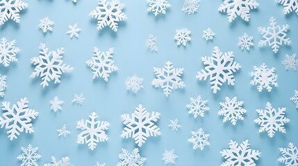 Winter white color decorations with snowflakes on a table. Minimal background.