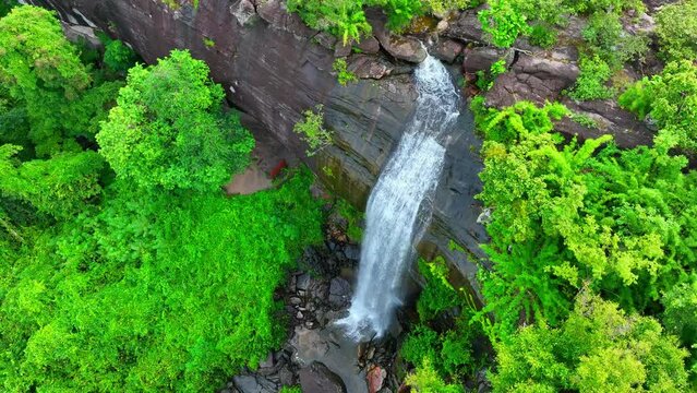 Pha Luang Waterfall is a stunning natural attraction located in the Ubon Ratchathani Province of Thailand, which is in the northeastern region of the country, known as Isaan. Aerial view. 4K.
