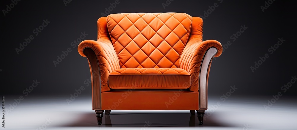 Wall mural Art deco style armchair in orange quilted fabric with brass legs isolated on white background Front view part of furniture series