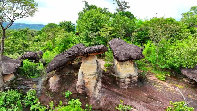 Sao Chaliang, part of Pha Taem National Park in Ubon Ratchathani, Thailand, boasts stunning rock formations and vibrant landscapes when viewed from above. Geological concept.

