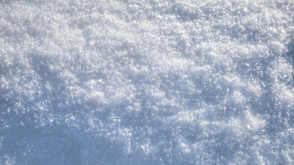 Obraz premium Fresh white snow texture top view. Perfection shining pure snowy background.