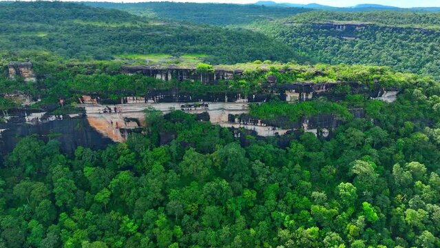 Pha Taem, seen from a drone, showcases ancient rock formations, revealing Earth's geological history through its stratigraphy and erosion patterns. Pha Taem National Park, Thailand. Travel concept.
