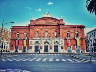 The facade of the Petruzzelli Theatre in Bari enchants onlookers with its imposing architecture and intricate details, reflecting the rich cultural and artistic history of this extraordinary structure