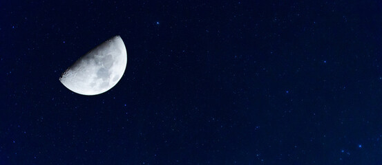 Amazing crescent moon on deep blue night sky background, universe full of stars, nebula and...