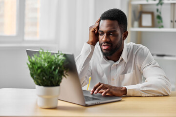 man education computer student african online freelancer american sitting laptop job office