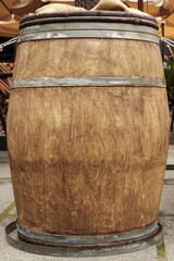 Fototapeta premium Traditional wooden barrel on city street outdoors