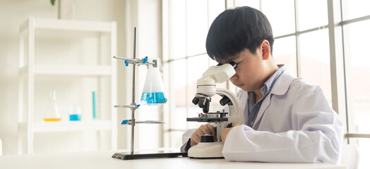 Children scientist learning on biology and chemistry in the laboratory. A STEM education learning...