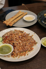 Fried Mantis shrimps with Fried Garlic and Cucumber on table background. Asian delicious seafood.