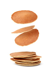 Many tasty fresh pancakes falling on white background