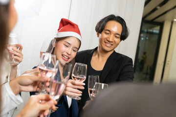 Making a toast, Cheers !! Asian business people and colleagues having fun and meet up together at a business New Year party. A teamwork celebration of a successful business target.