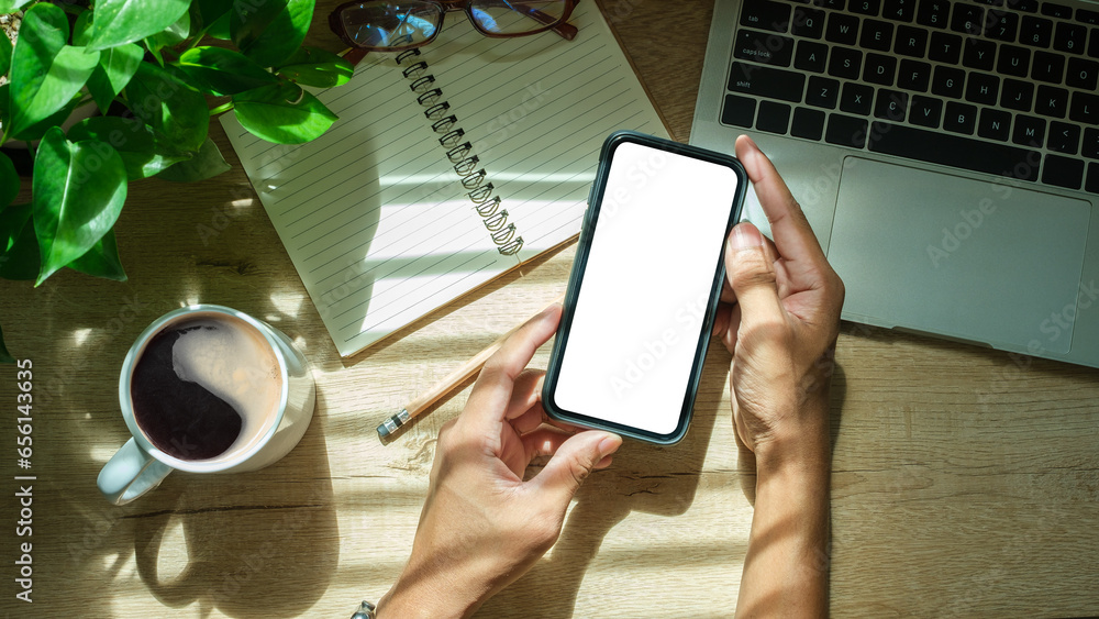 Poster man hands holding smart phone with blank screen for your text message or information content.