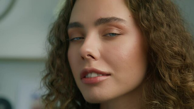 Close up portrait of beautiful mixed race girl smiling blowing air kiss. Charming seductive lips, beautiful smile, happy Gen Z young adult. Positive beautiful 20s female. Fashion portrait slow motion