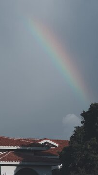 After the rain, a beautiful and mysterious rainbow appeared in the sky.Rainbows and Sky