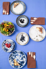 Earth day food on blue background with berries and plated