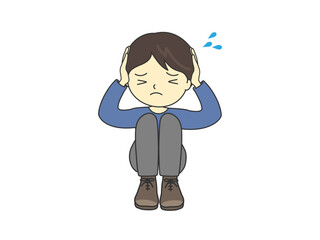 混乱しておびえて、頭を抱える男の子