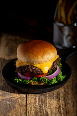 Cheeseburger with French Fries in back