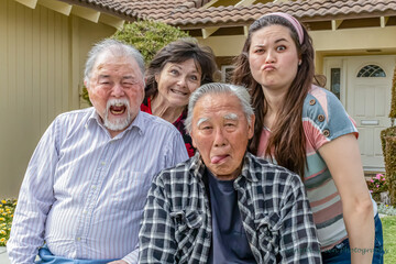 Four family members making faces at the camera, horizontal