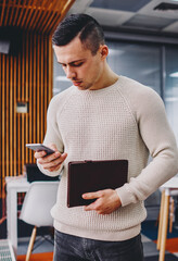 Pensive student checking email on cellular