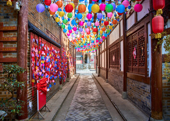 Fototapeta premium An alley full of lanterns in the ancient city of Langzhong, Sichuan, China