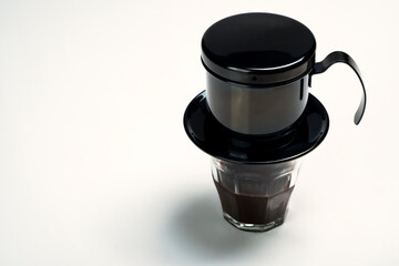 Cup of coffee with a Vietnam drip coffee maker