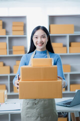 small business entrepreneur Happy independent Asian woman smiling Young successful Asian woman Packaging, online marketing and shipping ideas