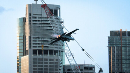 Fototapeta premium Millitary airplane over city