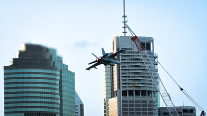 Fototapeta premium Millitary airplane over city